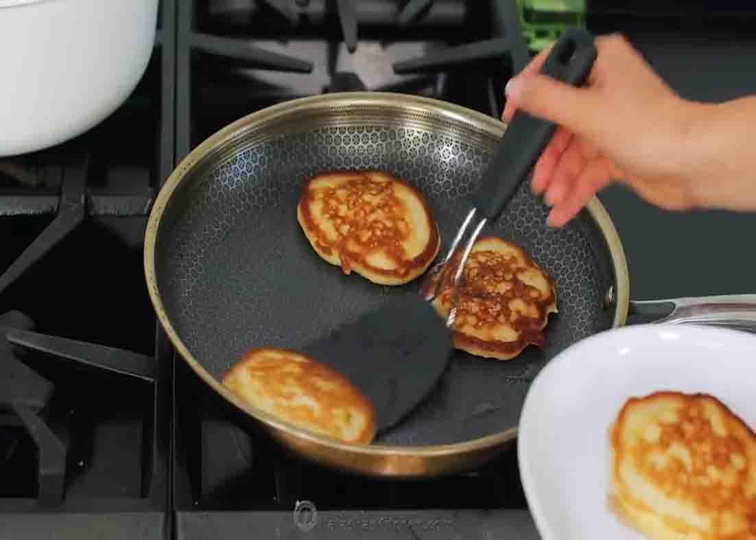 Cooking the cinnamon apple pancakes