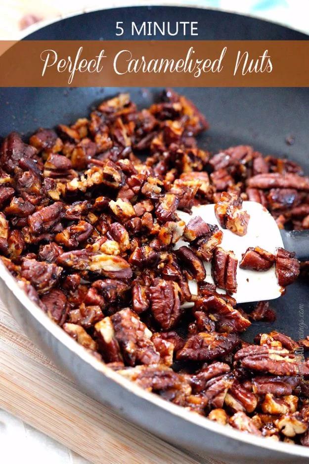Glossy caramelized nuts cooling on parchment, an easy five minute stovetop sweet snack and salad topping
