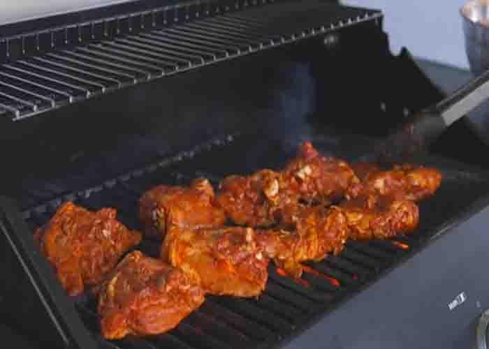 Grilling the chipotle al pastor chicken