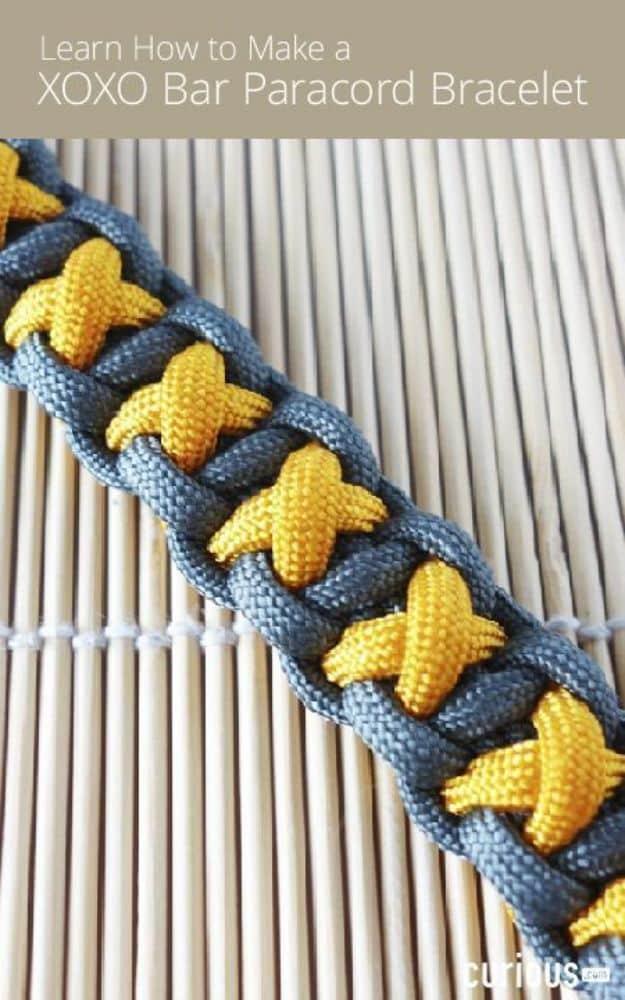 Typeset graphic reading Learn How to Make a XOXO Bar Paracord Bracelet over yellow X shapes on denim blue