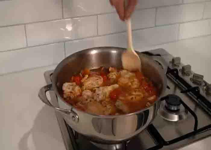Simmering the one-pot chicken chorizo