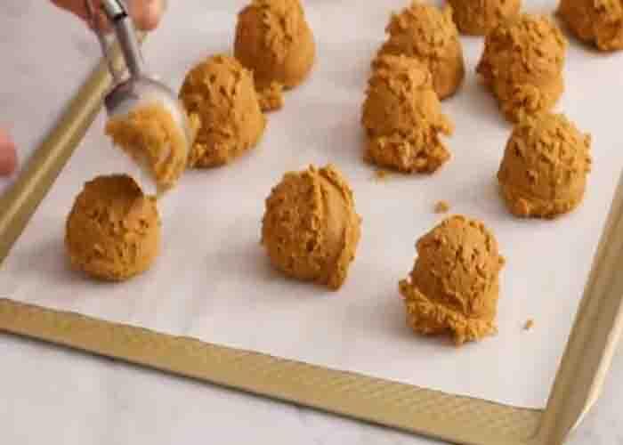 Molding the pumpkin cookies
