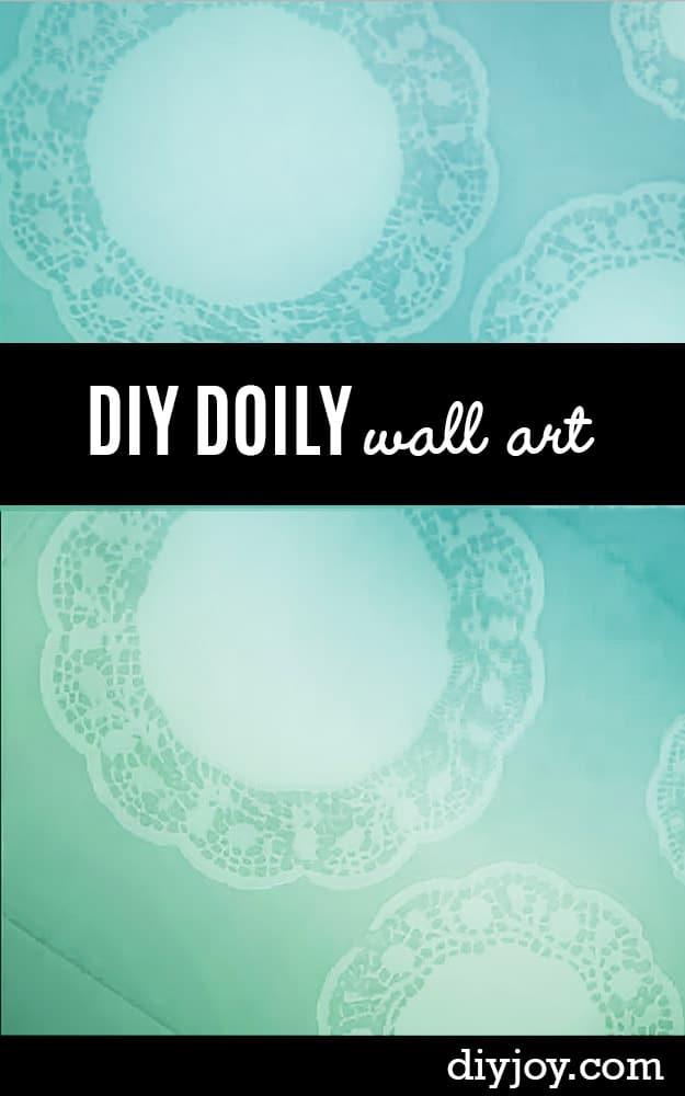 Doily wall art canvas in soft aqua and mint showing lace patterns left behind where paper doilies masked the paint