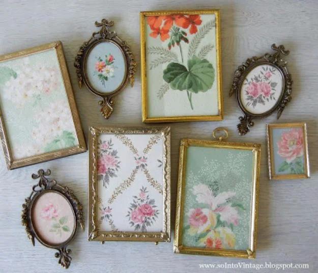 Framed vintage wallpaper art, eight small brass and gilt frames filled with floral wallpaper laid out on pale grey wood