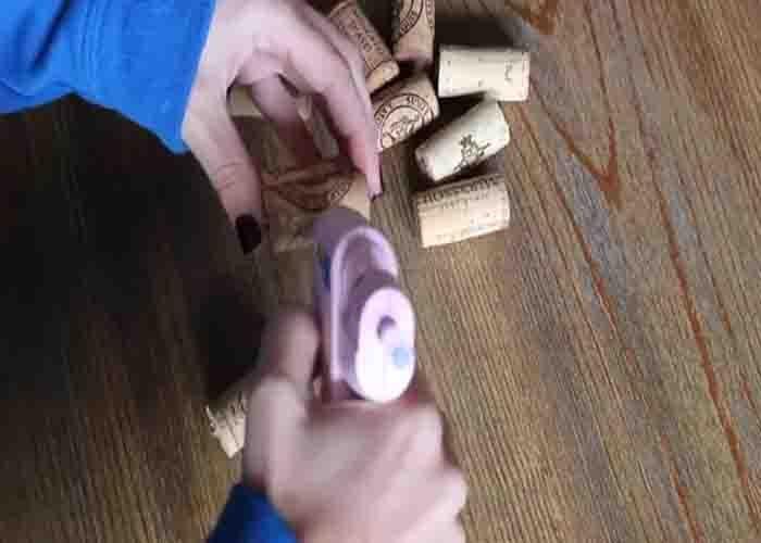 Attaching the wine corks together to make the pumpkin