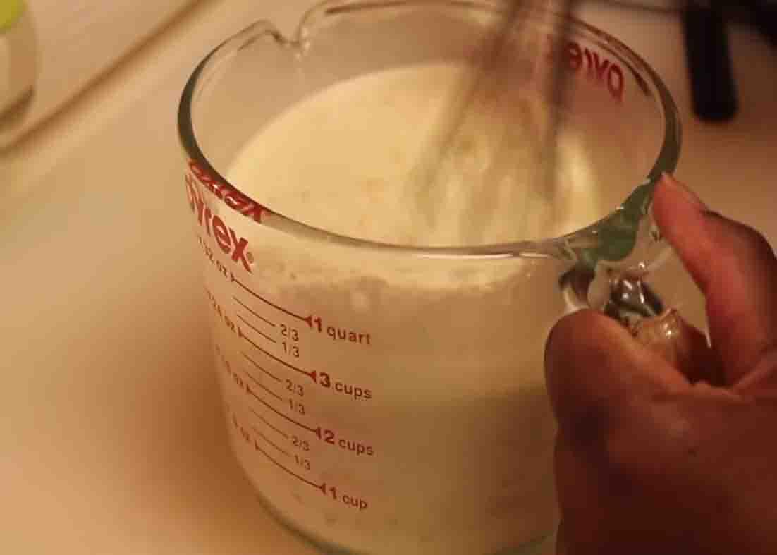 Mixing the cream mixture for the macaroni and cheese