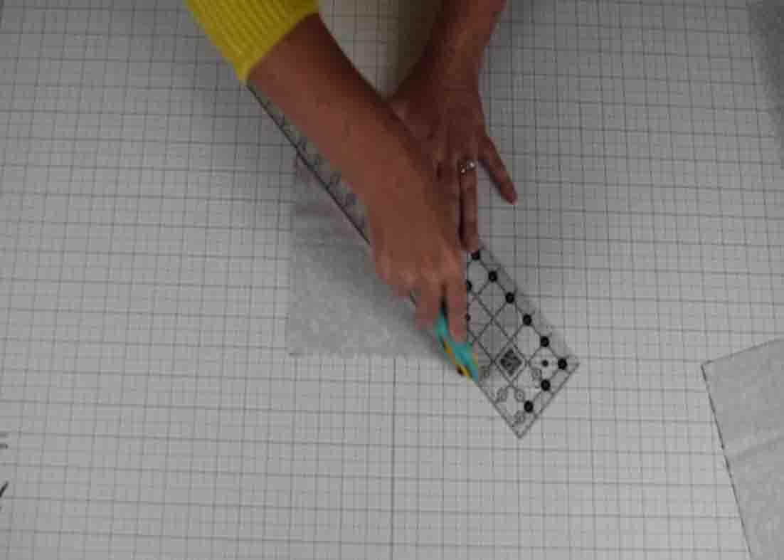 Cutting the quilt blocks diagonally for the prairie quilt