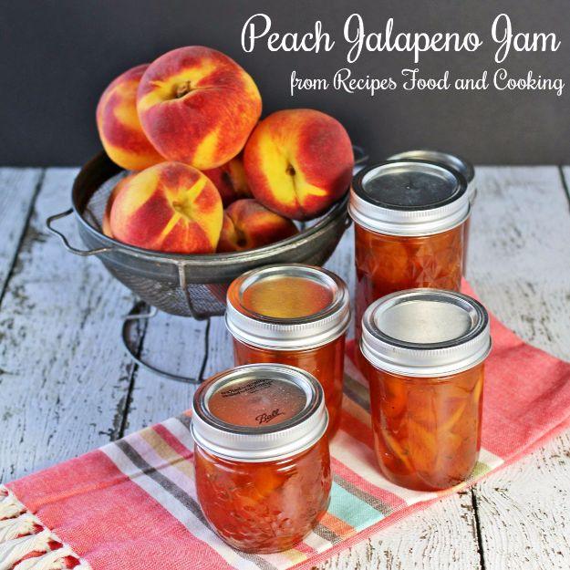 Peach jalapeno jam in a jar, golden with flecks of green pepper, served over brie cheese with crackers