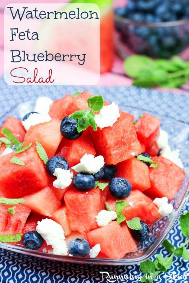 Watermelon feta blueberry salad with cubed watermelon, blueberries, crumbled feta and mint in a clear glass bowl