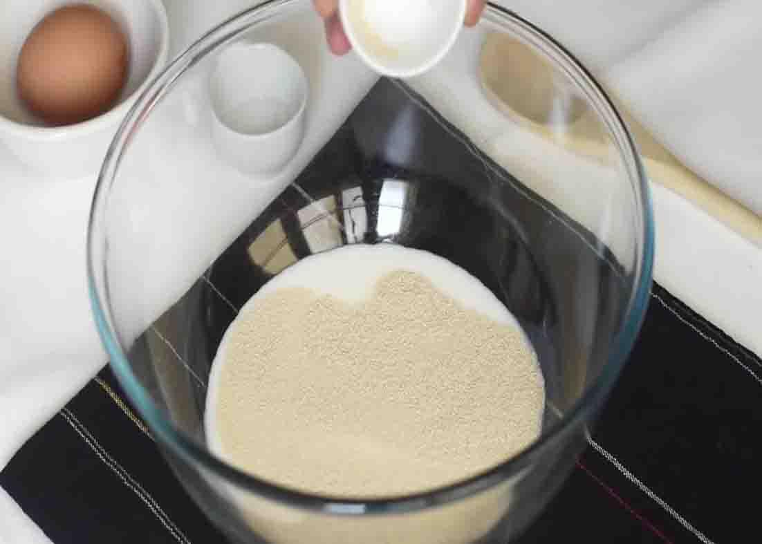 Combining all the ingredients to make the dough for the dinner rolls