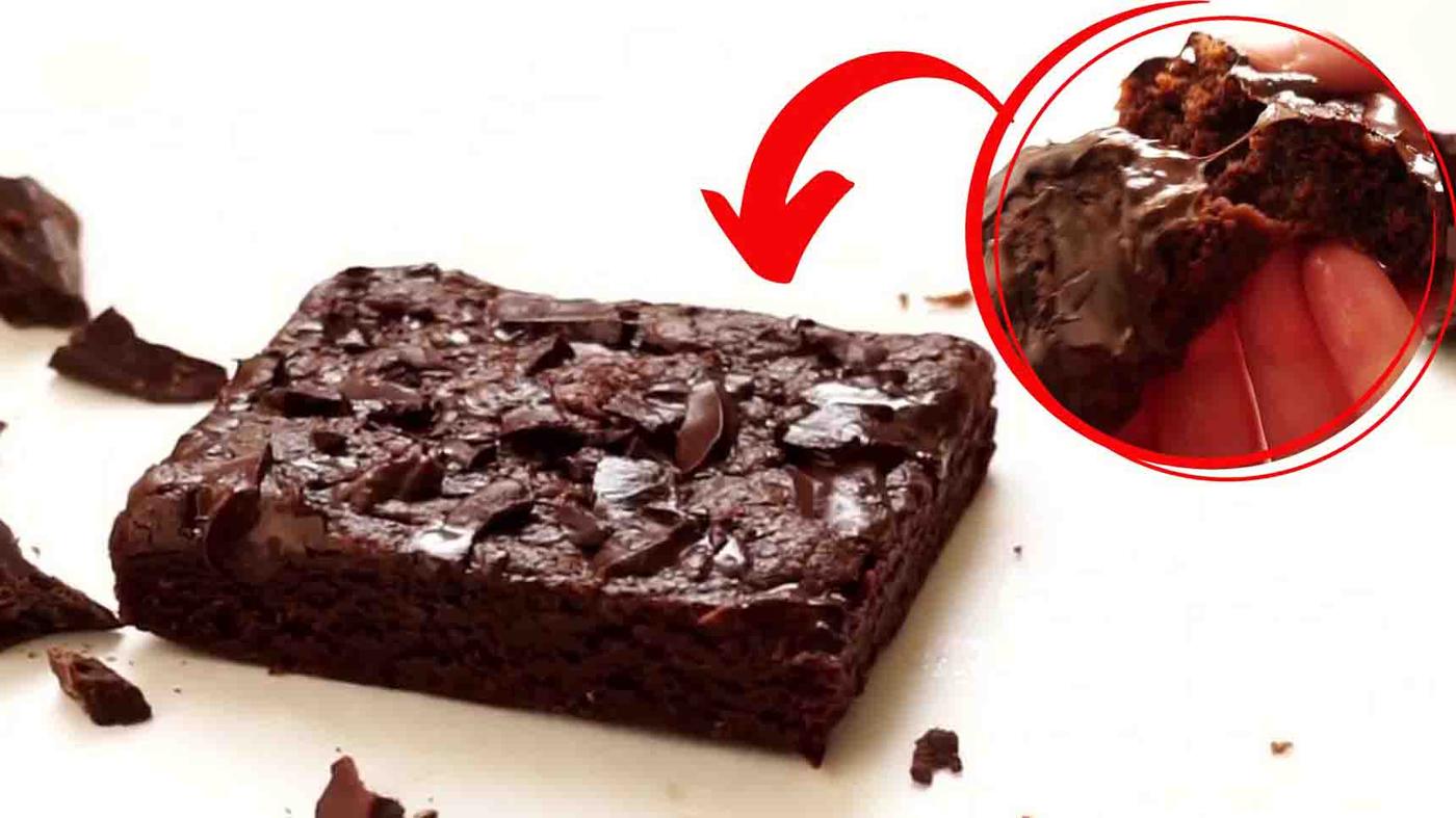 One minute microwave brownie in a mug with melted chocolate chunks, an easy single serving dessert made in one mug