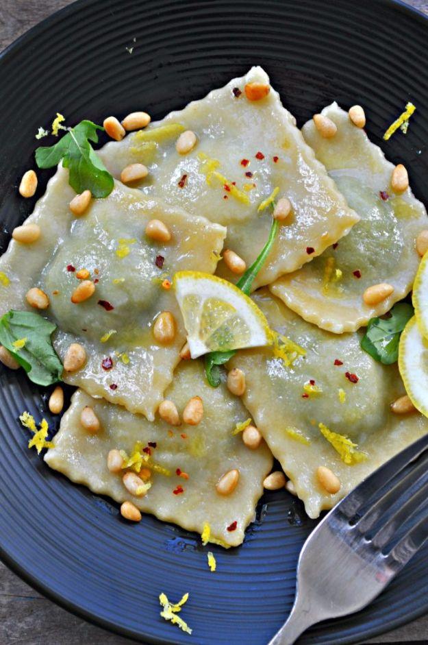 Vegan broccoli rabe pesto ravioli, fresh pasta squares filled with green pesto and finished with pine nuts