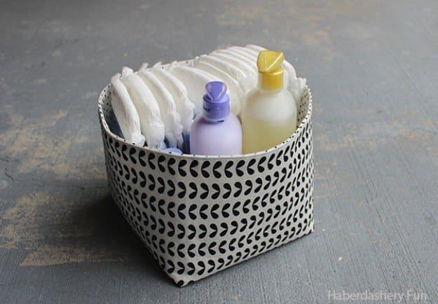 DIY reversible fabric storage bin, a home sewing project holding bottles, black and white print with a folded rim
