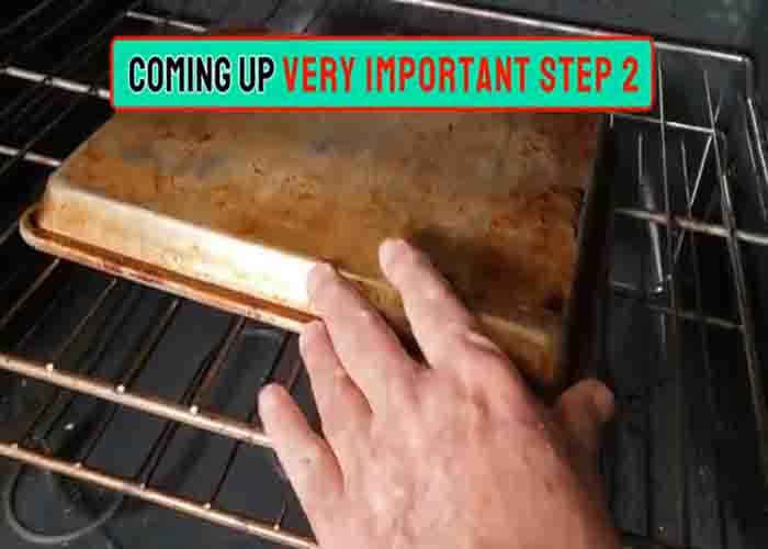 Placing the dirty sheet pan inside the oven