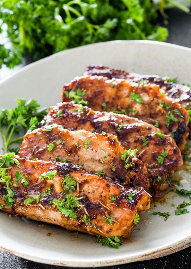Mustard balsamic chops with rosemary, sliced and glazed dark brown, scattered with chopped fresh parsley