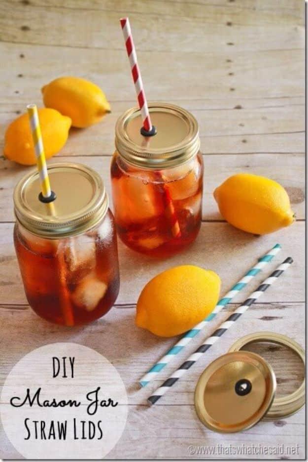 DIY mason jar straw lids for picnics, two jars of iced tea with straws through drilled lids beside lemons and straws