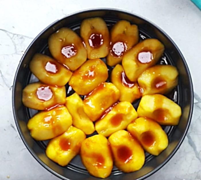Add Cooked Apples To A Baking Pan An Cook A Giant Cinnamon Roll On Top