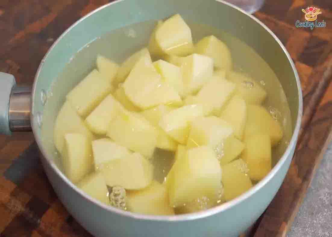 Boiling the potatoes to make the potato sticks