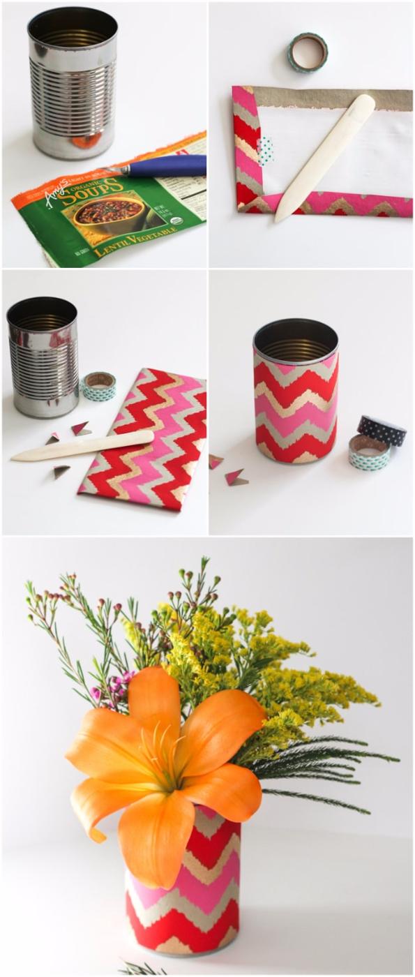 Soup can flower vases, a tin can wrapped in pink chevron paper holding orange lilies and yellow flowers on a white table