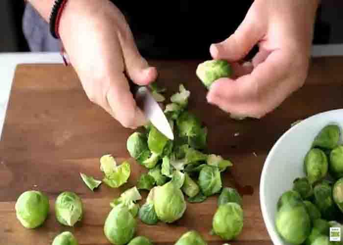 Cutting the brussels sprouts for the side dish recipe