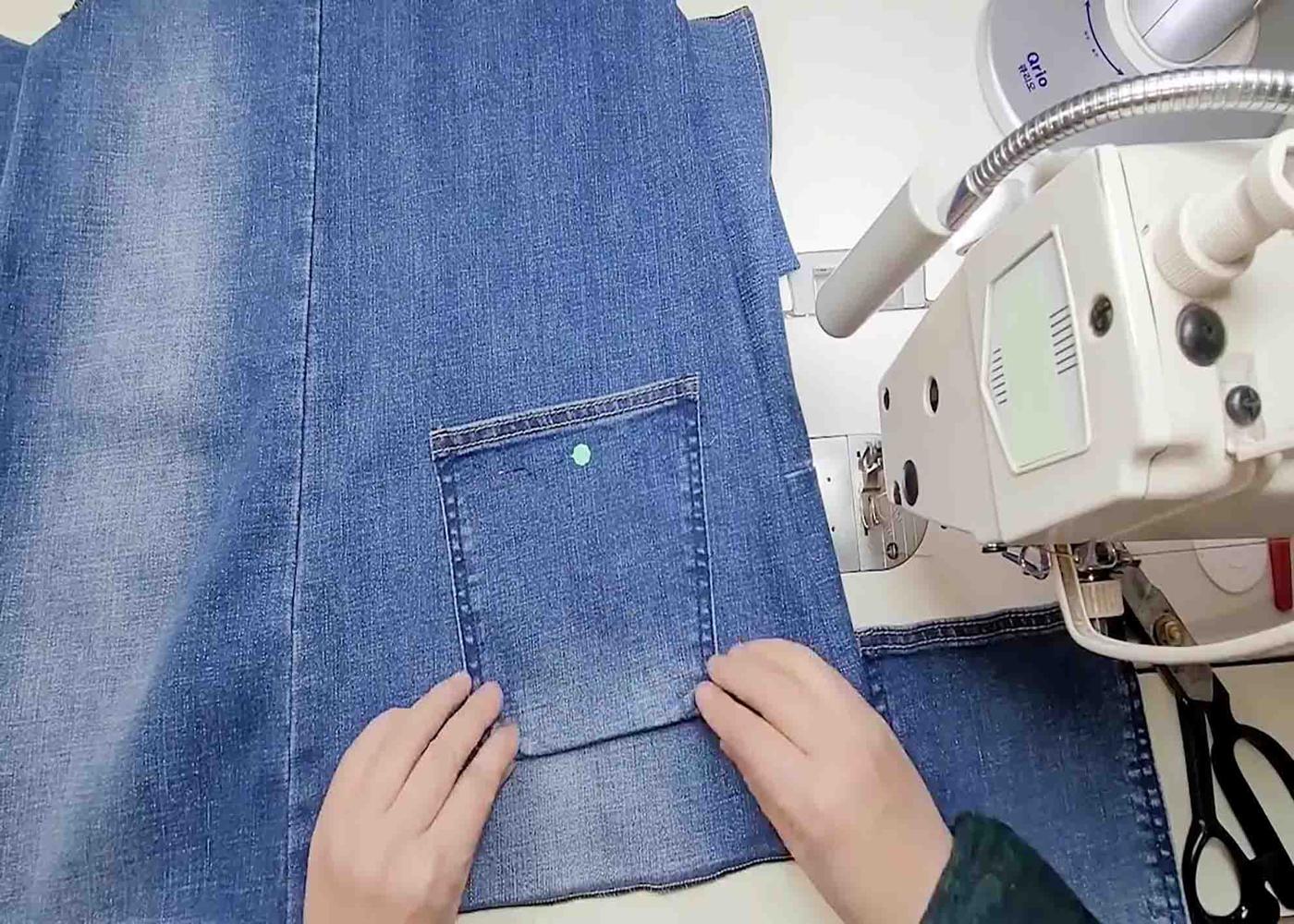 Attaching the pockets of the upcycled denim dress