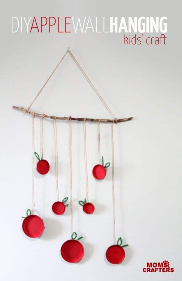 Apple craft tutorial with easy classroom project and creative seasonal tutorial, highlighting the finished apple wall hanging