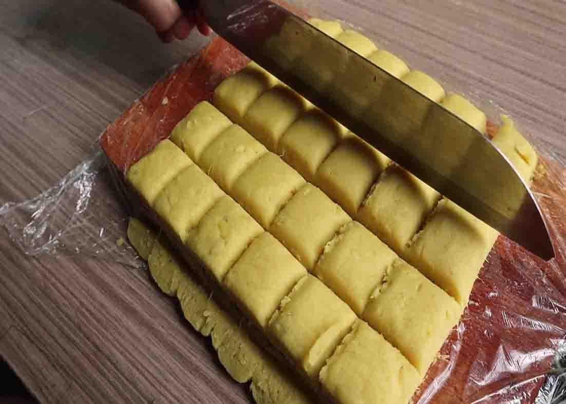 Cutting the sweet potato mini cakes into bite-size pieces