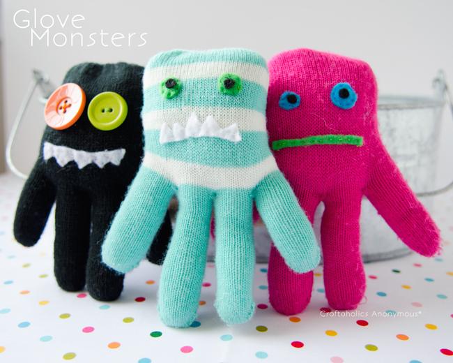 Three stuffed monsters sewn from colorful knit gloves with felt eyes and stitched smiles, the fingers turned into limbs