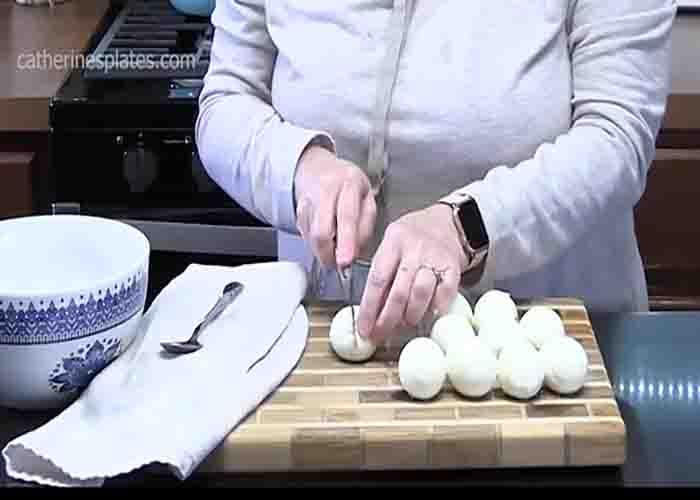 Slicing the eggs for the deviled eggs recipe