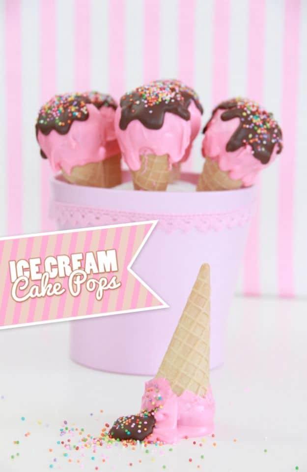 Ice cream cake pops shaped like tiny melting ice cream cones with drips down the sides on sticks, a playful frozen look