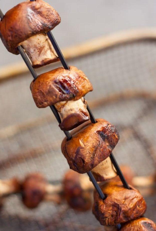 Ginger garlic teriyaki mushroom skewers grilling, whole crimini mushrooms glazed and browned, gluten free