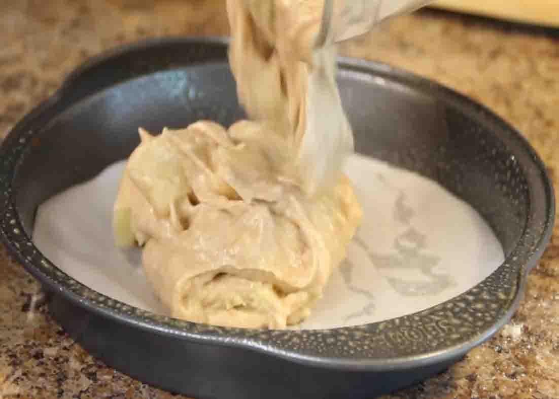 Pouring the pineapple cake batter to the cake pan