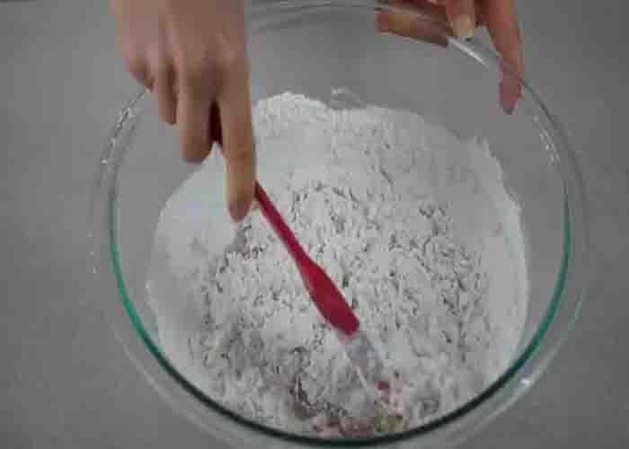 Mixing the flour mixture for the glazed cinnamon coffee muffins