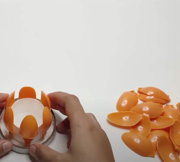 making candle holder out of plastic spoons