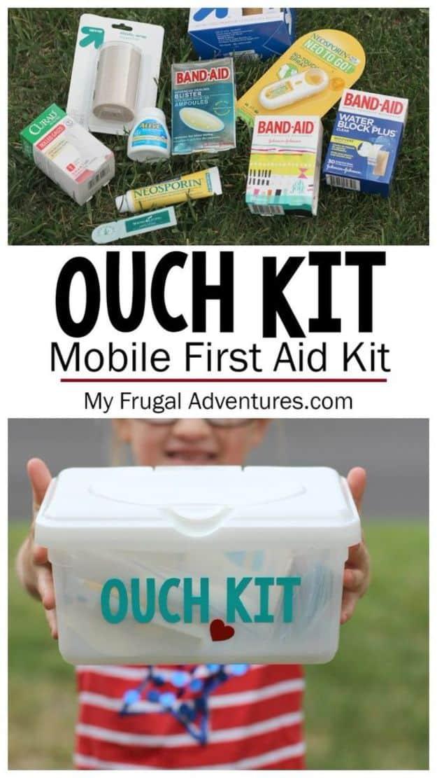 DIY car first aid kit, a clear wipes tub labeled Ouch Kit held by a child, with bandages and ointment laid out above