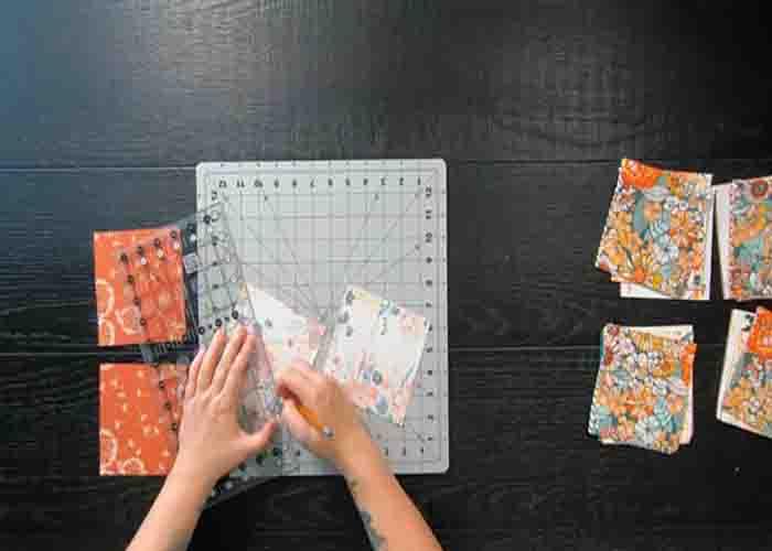 Making the half-square triangles for the clustered gems quilt