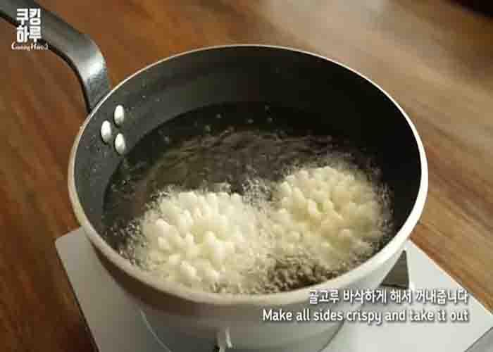 Deep frying the potato flowers