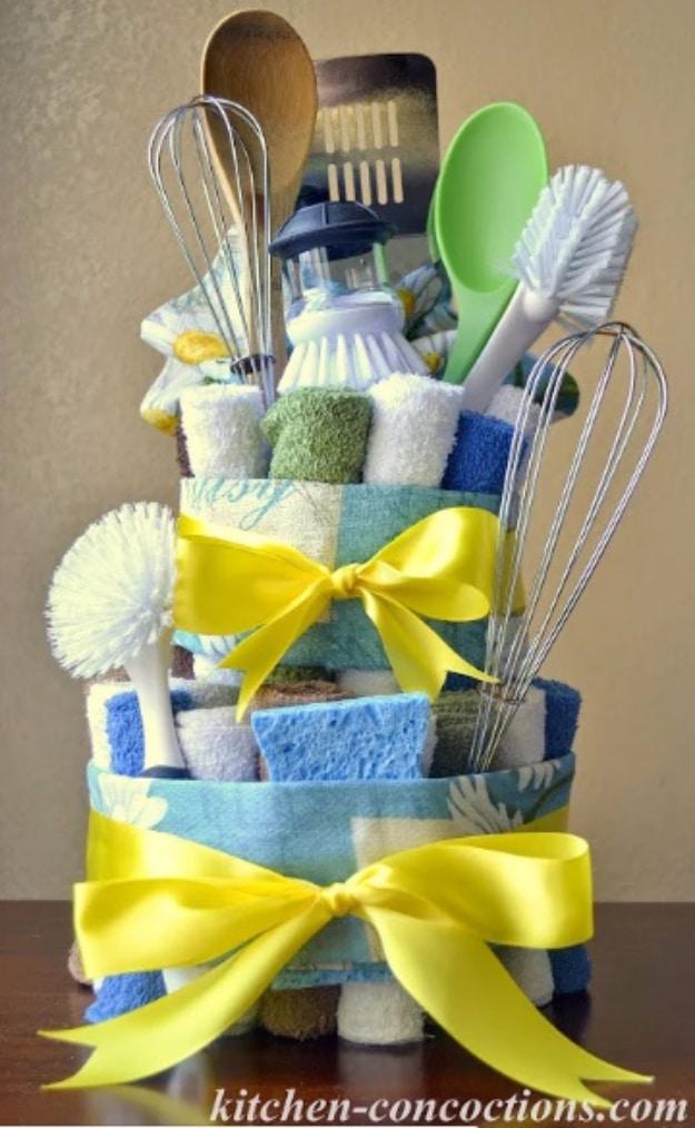 New home gift idea shaping dish towels into a stacked cake for the kitchen for a fun afternoon project