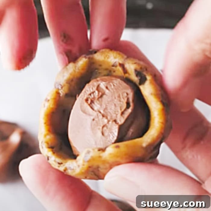 Decadent Nutella-Stuffed Chocolate Chunk Cookies 3 Homemade Nutella stuffed chocolate chunk cookies presented beautifully, perfect for a gift or dessert