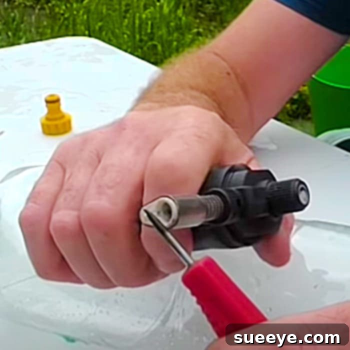 Soda Bottle Sprinkler Hack 2 Image showing the materials used for the DIY soda bottle sprinkler project, including a plastic bottle, ice pick, lighter, and hose connector.