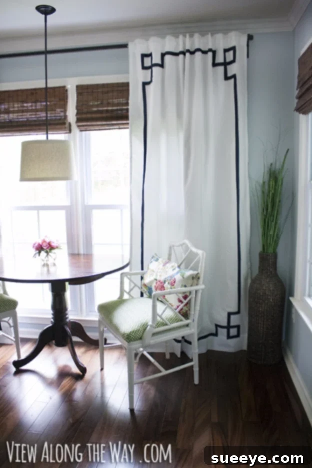 No Sew Greek Key Curtain Panels Elegant white curtain panels with a no-sew Greek key trim.