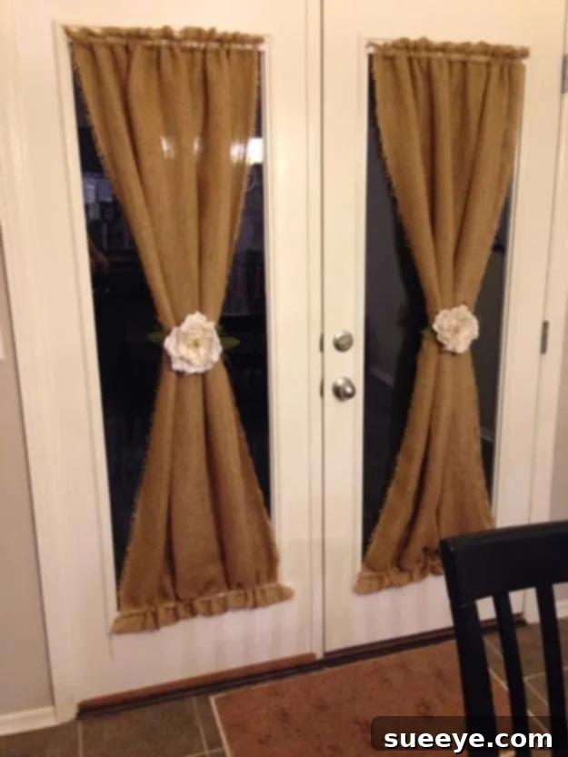 DIY Burlap Curtains Rustic DIY burlap curtains adding texture to a window.