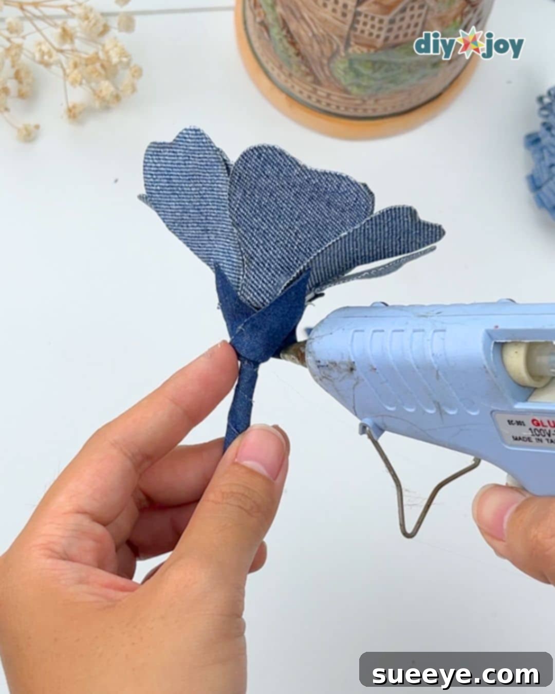 Easy denim flower tutorial: gluing triangles below the flower