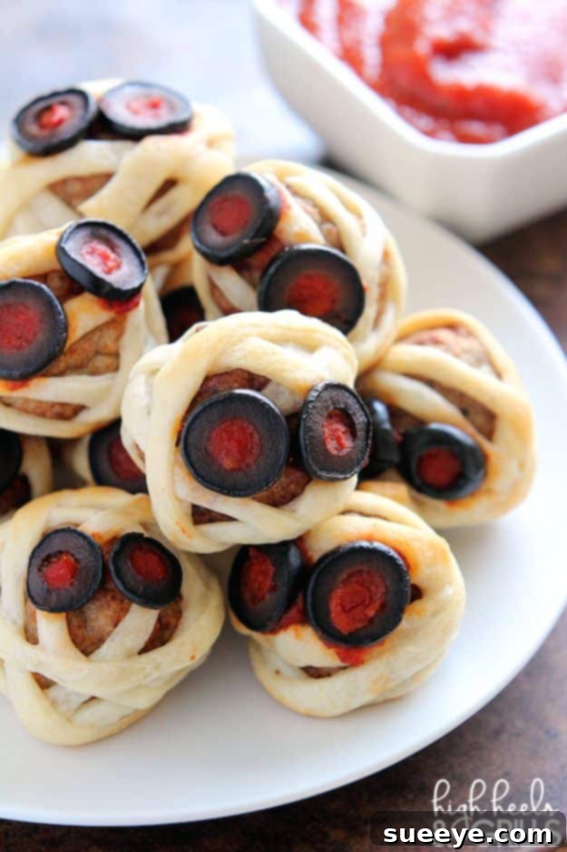 Easy Halloween Meatball Mummies Appetizer Spooky Meatball Mummies Wrapped in Crescent Dough