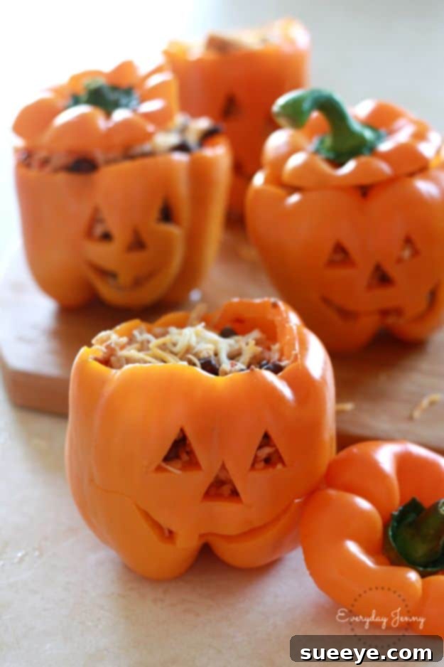 Creative Shredded Chicken and Rice Stuffed Peppers for Halloween Halloween Jack-O'-Lantern Stuffed Peppers