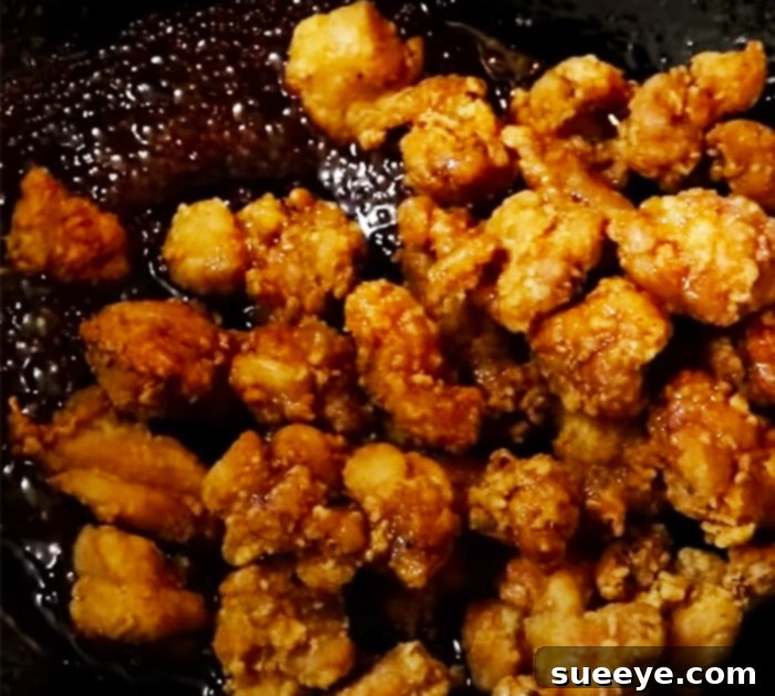 The Ultimate Homemade Sesame Chicken 3 Mix The Sesame Chicken In Sauce For Perfect Homemade Takeout - Sesame Chicken Recipe
