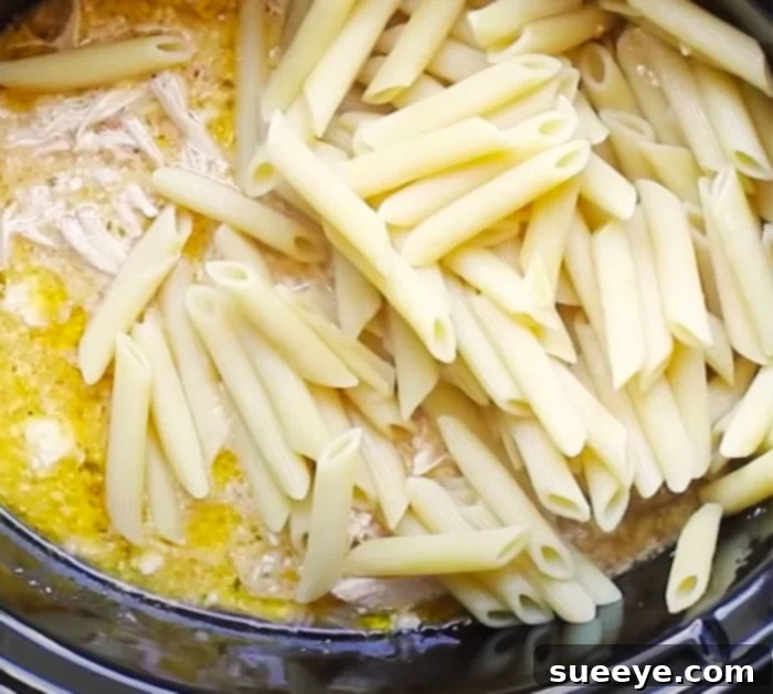 Creamy Slow Cooker Penne Pasta with Shredded Chicken and Olive Garden Dressing