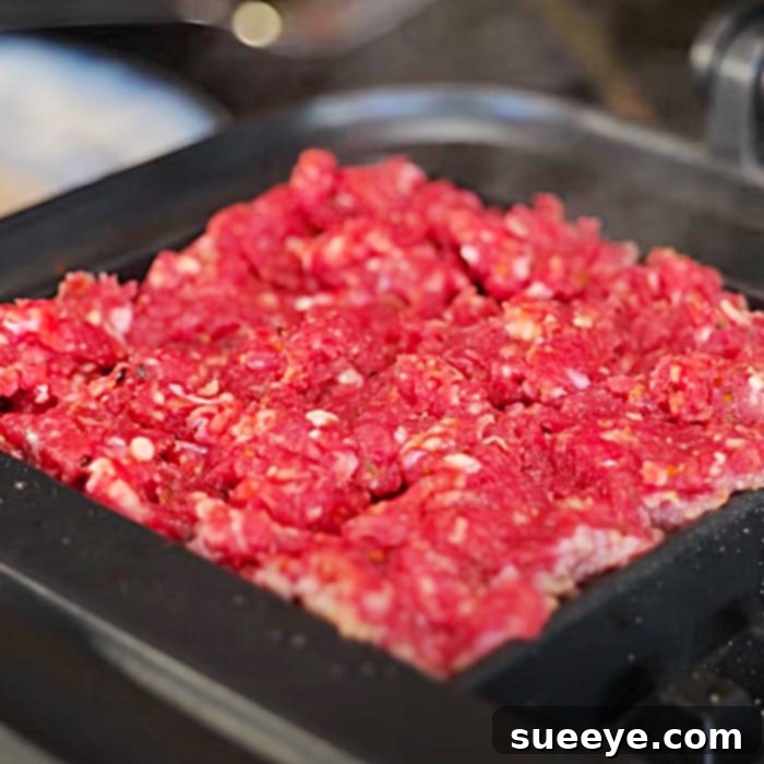 Steak Waffle Fusion 2 Crispy ground steak waffle patties cooked in a waffle iron, perfect for sandwiches or salads. An easy and quick way to make hamburgers.