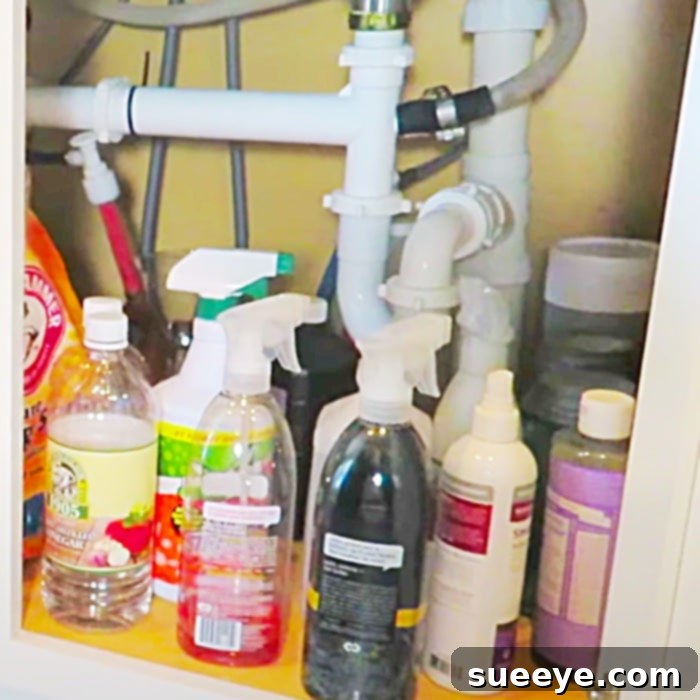 Conquer Under Sink Clutter With One Simple Rod 2 Easy Way To Organize Under The Sink Using A Tension Rod - Cleaning Hacks - Organize Under The Sink