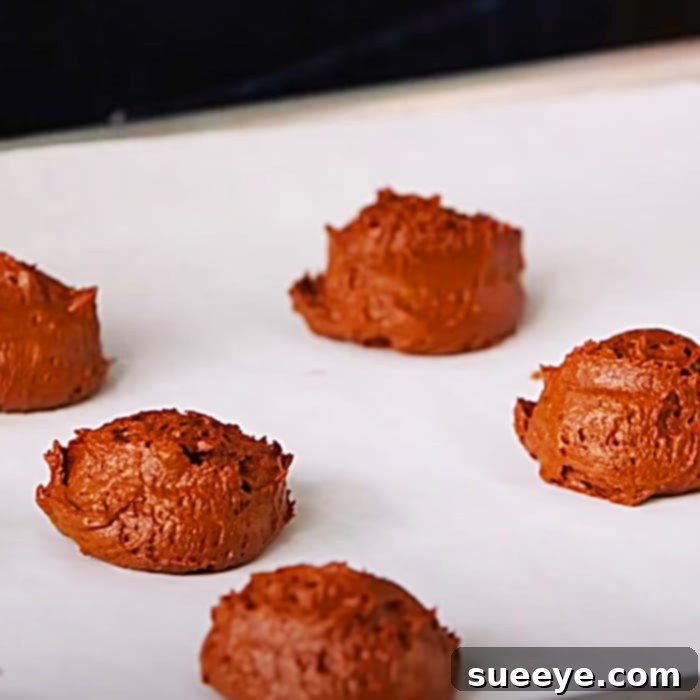 Homemade Chocolate Whoopie Pies 2 Homemade Whoopie Pie Recipe: Perfectly baked soft chocolate cookie halves on a cooling rack, ready for creamy vanilla filling. Easy dessert for any occasion.